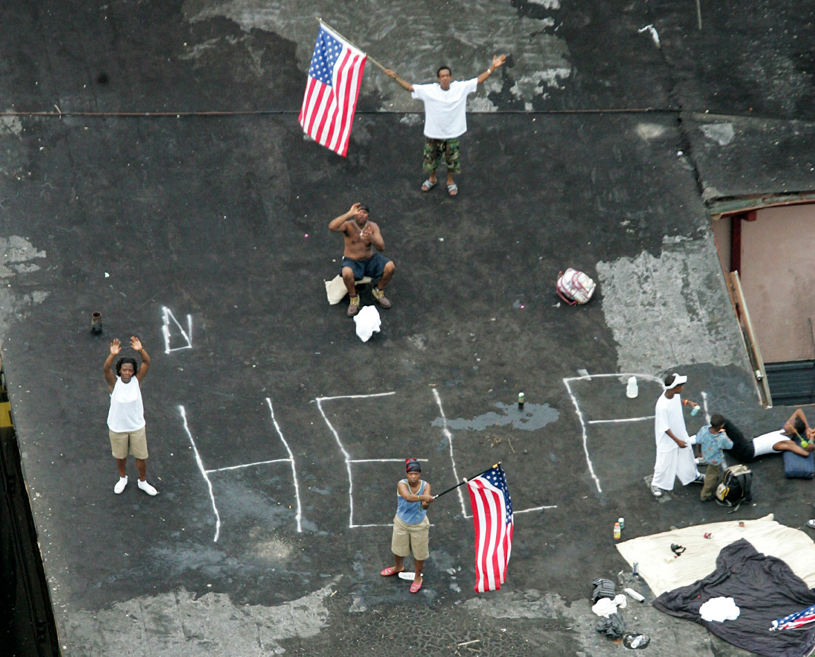 Residents wait on a roof top to be rescued from the floodwaters of Hurricane Katrina in New Orleans ..